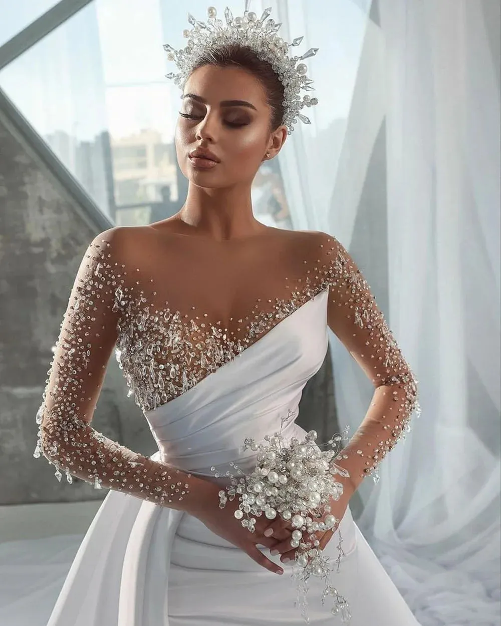 Elegant Mermaid Wedding Dress with Illusion Neckline, Beaded Long Sleeves, and a Detachable Overskirt